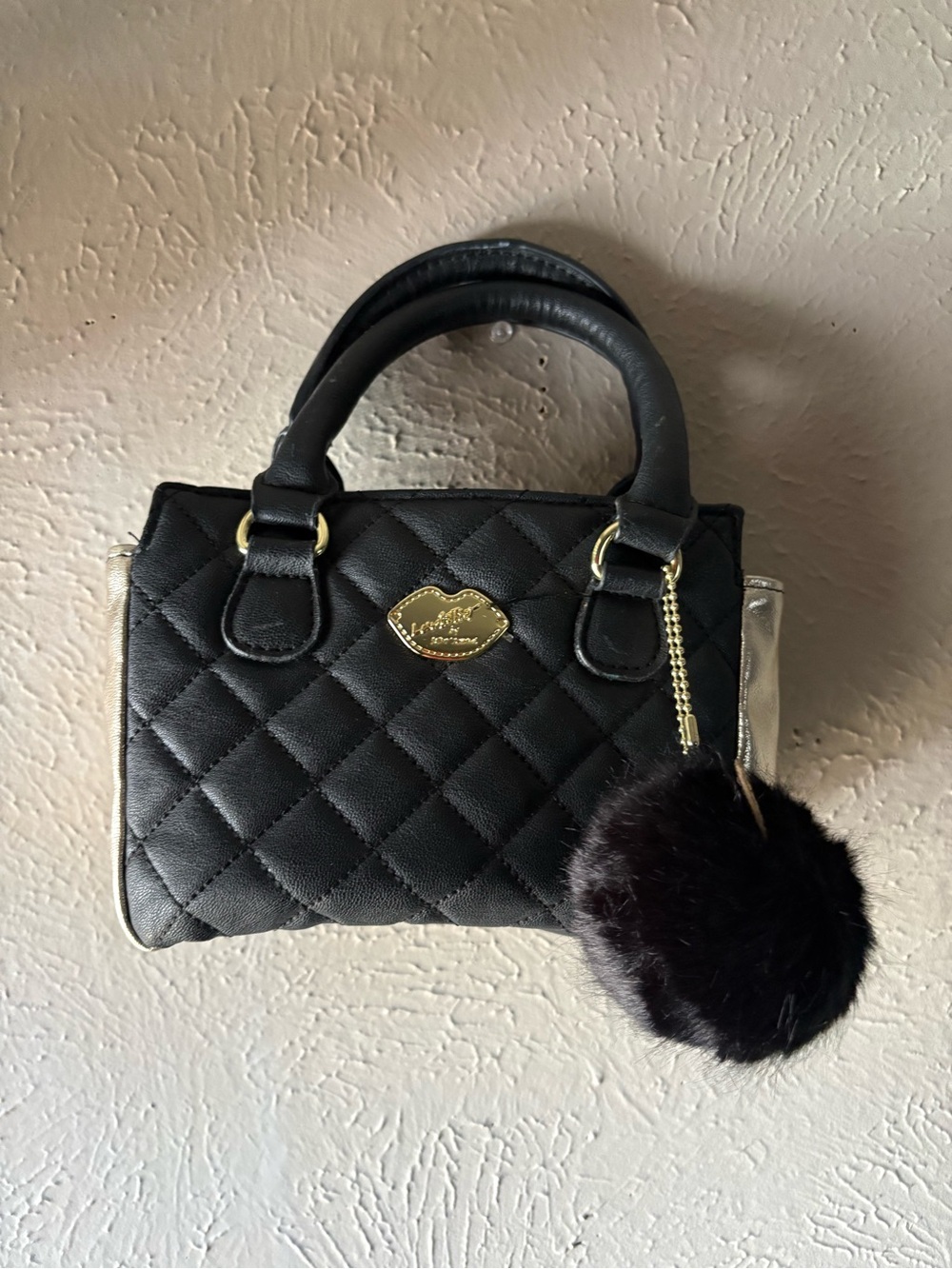Quilted Black Top-Handle Tote with Pom Charm